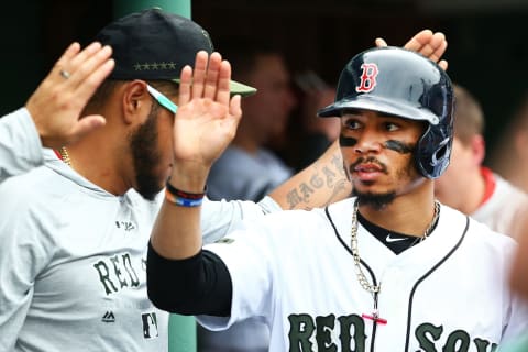 BOSTON, MA – MAY 26: Mookie Betts #50 of the Boston Red Sox returns to the dugout after scoring in the sixth inning of a game against the Atlanta Braves at Fenway Park on May 26, 2018 in Boston, Massachusetts. (Photo by Adam Glanzman/Getty Images)