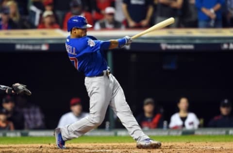 Nov 2, 2016; Cleveland, OH, USA; Chicago Cubs shortstop Addison Russell drives in a run with a sacrifice fly against the Cleveland Indians in the fourth inning in game seven of the 2016 World Series at Progressive Field. Mandatory Credit: Tommy Gilligan-USA TODAY Sports