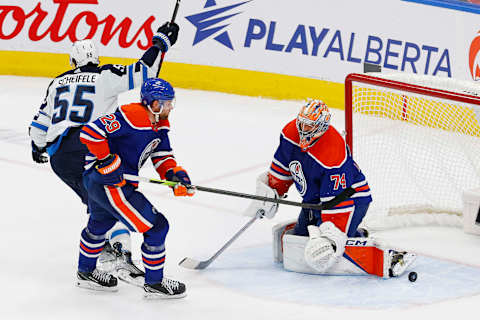 Oct 21, 2023; Edmonton, Alberta, CAN; Winnipeg Jets forward Mark Scheifele (55) celebrates a game winning goal during overtime against Edmonton Oilers goaltender Stuart Skinner (74) at Rogers Place. Mandatory Credit: Perry Nelson-USA TODAY Sports