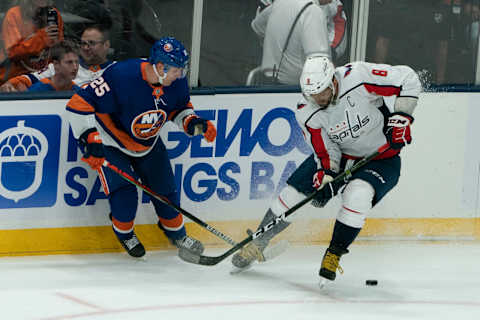 UNIONDALE, NY – OCTOBER 04: New York Islanders Defenseman Devon Toews (25) and Washington Capitals Left Wing Alex Ovechkin (8) battle for the puck during the third period of the game between the Washington Capitals and the New York Islanders on October 4, 2019, at Nassau Veterans Memorial Coliseum in Uniondale, NY. (Photo by Gregory Fisher/Icon Sportswire via Getty Images)