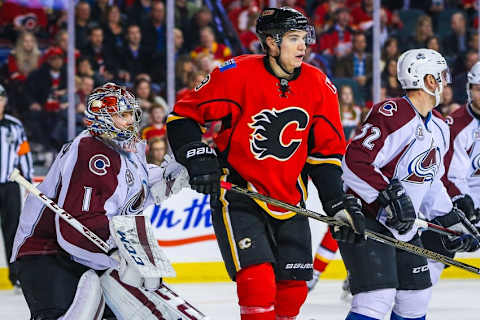 Mar 18, 2016; Calgary, Alberta, CAN; Calgary Flames center Joe Colborne (8) screens in front of Colorado Avalanche goalie Semyon Varlamov (1) during the second period at Scotiabank Saddledome. Colorado Avalanche won 4-3. Mandatory Credit: Sergei Belski-USA TODAY Sports