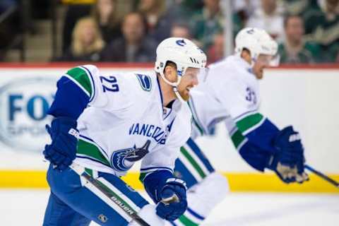 Nov 25, 2015; Saint Paul, MN, USA; Vancouver Canucks forward Daniel Sedin (22) and forward Henrik Sedin (33) skate up ice in the second period against the Minnesota Wild at Xcel Energy Center. Mandatory Credit: Brad Rempel-USA TODAY Sports