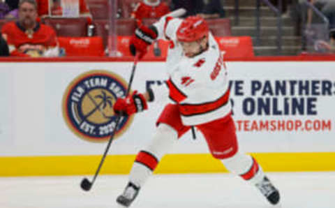 Apr 13, 2023; Sunrise, Florida, USA; Carolina Hurricanes defenseman Shayne Gostisbehere (41) shoots the puck during the first period against the Florida Panthers at FLA Live Arena. Mandatory Credit: Sam Navarro-USA TODAY Sports