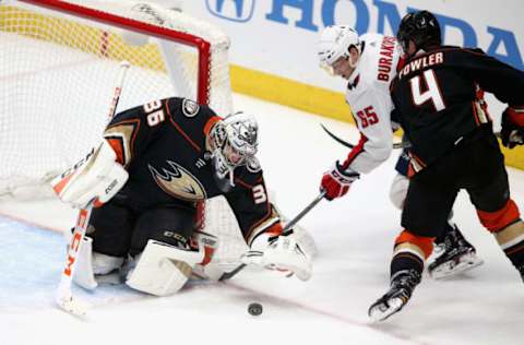 ANAHEIM, CA – MARCH 06: Cam Fowler #4 and John Gibson #36 of the Anaheim Ducks defend against Andre Burakovsky #65 of the Washington Capitals during the third period on March 6, 2018. (Photo by Sean M. Haffey/Getty Images)