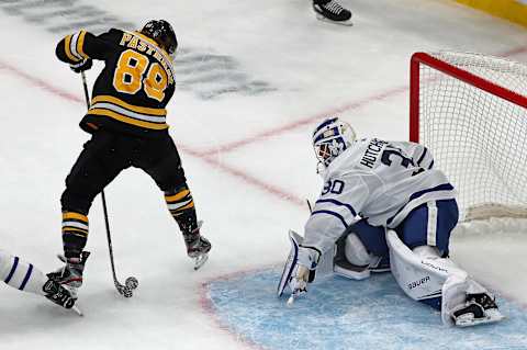 BOSTON – OCTOBER 22: Boston Bruins’ David Pastrnak (88) scores the first goal of the game in the first period as he puts the puck between his own legs and then through the legs of Toronto goalie Michael Hutchinson (30). The Boston Bruins host the Toronto Maple Leafs in a regular season NHL hockey game at TD Garden in Boston on Oct. 22, 2019. (Photo by Jim Davis/The Boston Globe via Getty Images)