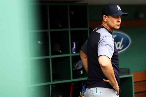 BOSTON, MA – AUGUST 04: Manger Aaron Boone of the New York Yankees looks inform the dugout before a game against the Boston Red Sox at Fenway Park on August 4, 2018 in Boston, Massachusetts. (Photo by Adam Glanzman/Get-ty Images)