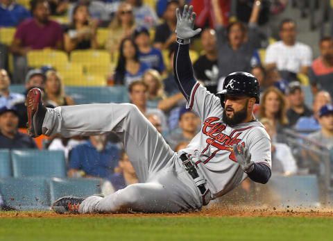 LOS ANGELES, CA – JUNE 08: Kurt Suzuki #24 doubles in Nick Markakis #22 of the Atlanta Braves as he beats the throw from Joc Pederson #31 to Yasmani Grandal #9 of the Los Angeles Dodgers as he scores a run on a double by Kurt Suzuki #24 of the Atlanta Braves in the fifth inning of the game at Dodger Stadium on June 8, 2018 in Los Angeles, California. (Photo by Jayne Kamin-Oncea/Getty Images)