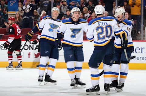 GLENDALE, ARIZONA – DECEMBER 31: Tyler Bozak #21 of the St. Louis Blues celebrates with Alexander Steen #20 and Robert Thomas #18 after scoring a goal against the Arizona Coyotes during the first half of the NHL game at Gila River Arena on December 31, 2019 in Glendale, Arizona. (Photo by Christian Petersen/Getty Images)