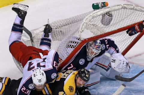 BOSTON – MARCH 19: The net ends up on top of the Bruins’ David Krejci as he and the Blue Jackets’ Ian Cole, left, battle in the second period. The Boston Bruins host the Columbus Blue Jackets in a regular season NHL hockey game at TD Garden in Boston on March 19, 2018. (Photo by Jim Davis/The Boston Globe via Getty Images)