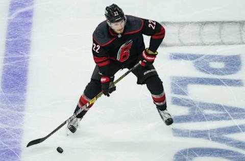 RALEIGH, NC – APRIL 18: Carolina Hurricanes defenseman Brett Pesce (22) controls a puck in the zone during a game between the Carolina Hurricanes and the Washington Capitals on April 18, 2019, at the PNC Arena in Raleigh, NC. (Photo by Greg Thompson/Icon Sportswire via Getty Images)