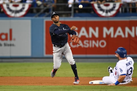 LOS ANGELES, CA – OCTOBER 04: Atlanta Braves second baseman Ozzie Albies (1) turns a double play as Los Angeles Dodgers infielder Max Muncy (13) slides into second base during Game 1 of the 2018 National League Division Series between the Atlanta Braves and the Los Angeles Dodgers on October 4, 2018 at Dodger Stadium in Los Angeles, CA.