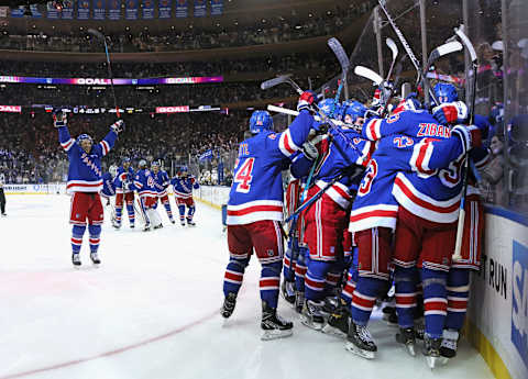 NEW YORK, NEW YORK – MAY 15: Artemi Panarin #10 of the New York Rangers celebrates his game winning overtime goal against the Pittsburgh Penguins in Game Seven of the First Round of the 2022 Stanley Cup Playoffs at Madison Square Garden on May 15, 2022 in New York City. (Photo by Bruce Bennett/Getty Images)