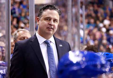 VANCOUVER, BC – APRIL 2: Head coach Travis Green of the Vancouver Canucks looks on from the bench during their NHL game against the San Jose Sharks at Rogers Arena April 2, 2019 in Vancouver, British Columbia, Canada. (Photo by Jeff Vinnick/NHLI via Getty Images)”n