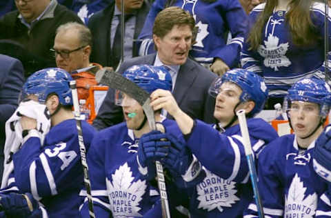 Feb 9, 2017; Toronto, Ontario, CAN; Toronto Maple Leafs head coach Mike Babcock (center) on the bench during a game against the St. Louis Blues at Air Canada Centre. St. Louis defeated Toronto 2-1 in overtime. Mandatory Credit: John E. Sokolowski-USA TODAY Sports