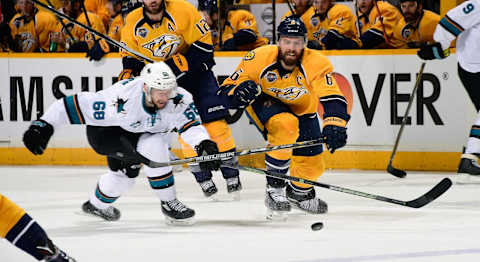 Melker Karlsson #68 of the San Jose Sharks and Shea Weber #6 of the Nashville Predators  (Photo by Frederick Breedon/Getty Images)