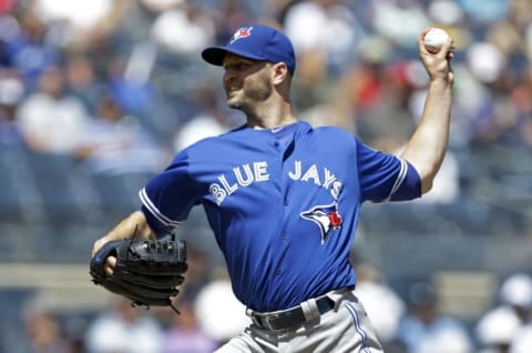 Aug 17, 2016; Bronx, NY, USA; Toronto Blue Jays starting pitcher J.A. Happ (33) delivers a pitch against the New York Yankees during the first inning at Yankee Stadium. Mandatory Credit: Adam Hunger-USA TODAY Sports