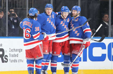 NEW YORK, NY – MARCH 22: Derek Stepan #21 of the New York Rangers celebrates after his second period goal with Mats Zuccarello #36, Ryan McDonagh #27 and Dan Girardi #5 against the Anaheim Ducks at Madison Square Garden on March 22, 2015 in New York City. (Photo by Jared Silber/NHLI via Getty Images)