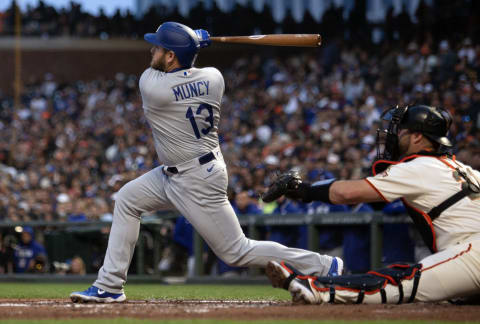 Apr 10, 2023; San Francisco, California, USA; Los Angeles Dodgers third baseman Max Muncy (13) follows through on his three-run home run against the San Francisco Giants during the third inning at Oracle Park. Mandatory Credit: D. Ross Cameron-USA TODAY Sports