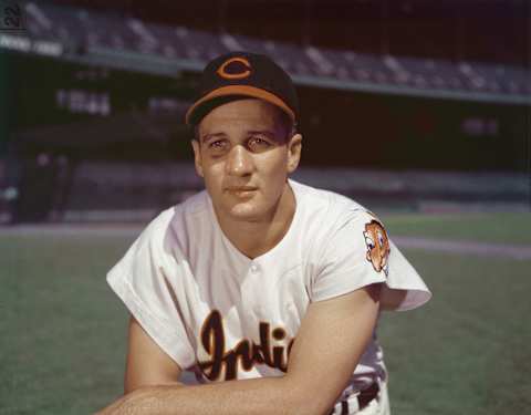 Portrait of American professional baseball player Al Rosen, third baseman for the Cleveland Indians, kneeling in an empty stadium, 1950s. (Photo by Hulton Archive/Getty Images)