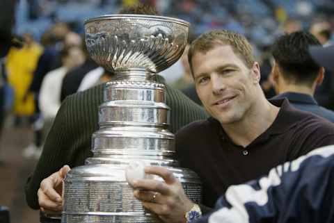 BRONX, NY – JUNE 13: Defenseman Scott Stevens #4 of the New Jersey Devils poses for a picture with the Stanley Cup before the interleague game between the New York Yankees and the St. Louis Cardinals at Yankee Stadium on June 13, 2003 in the Bronx, New York. The Yankees defeated the Cardinals 5-2. (Photo by Al Bello/Getty Images)