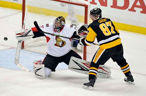 May 25, 2017; Pittsburgh, PA, USA; Pittsburgh Penguins center Sidney Crosby (87) tries to tip the puck past Ottawa Senators goalie Craig Anderson (41) during the first overtime period in game seven of the Eastern Conference Final of the 2017 Stanley Cup Playoffs at PPG PAINTS Arena. Mandatory Credit: Don Wright-USA TODAY Sports