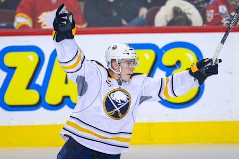 Dec 10, 2015; Calgary, Alberta, CAN; Buffalo Sabres defenseman Rasmus Ristolainen (55) celebrates his goal against the Calgary Flames during the third period at Scotiabank Saddledome. Calgary Flames won 4-3. Mandatory Credit: Sergei Belski-USA TODAY Sports