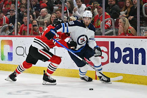 CHICAGO, ILLINOIS – MARCH 20: Pierre-Luc Dubois #80 of the Winnipeg Jets skates against the Chicago Blackhawks on March 20, 2022 at the United Center in Chicago, Illinois. (Photo by Jamie Sabau/Getty Images)