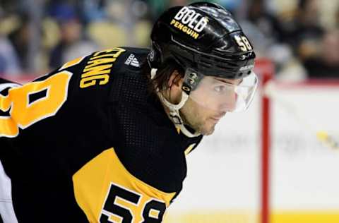 PITTSBURGH, PENNSYLVANIA – JANUARY 20: Kris Letang #58 of the Pittsburgh Penguins looks on during a game between the Pittsburgh Penguins and Ottawa Senators at PPG PAINTS Arena on January 20, 2022 in Pittsburgh, Pennsylvania. (Photo by Emilee Chinn/Getty Images)