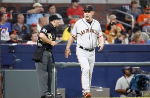 Jun 22, 2017; Atlanta, GA, USA; San Francisco Giants manager Bruce Bochy (15) talks to umpire Quinn Wolcott (81) against the Atlanta Braves in the fifth inning at SunTrust Park. Mandatory Credit: Brett Davis-USA TODAY Sports