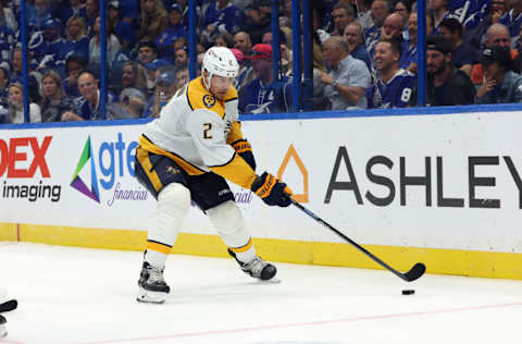 Oct 10, 2023; Tampa, Florida, USA; Nashville Predators defenseman Luke Schenn (2) skates with the puck against the Tampa Bay Lightning during the third period at Amalie Arena. Mandatory Credit: Kim Klement Neitzel-USA TODAY Sports