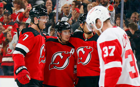 Jack Hughes #86 of the New Jersey Devils (2nd from left) celebrates his second goal. (Photo by Bruce Bennett/Getty Images)