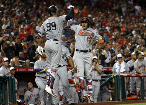 WASHINGTON, DC – JULY 17: Aaron Judge #99 of the New York Yankees and the American League celebrates with Manny Machado #13 of the Baltimore Orioles and the American League after hitting a solo home run in the second inning against the National League during the 89th MLB All-Star Game, presented by Mastercard at Nationals Park on July 17, 2018 in Washington, DC. (Photo by Patrick Smith/Getty Images)