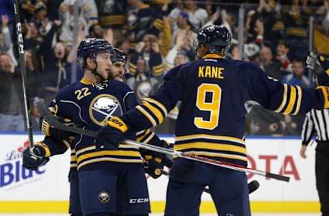 Nov 21, 2016; Buffalo, NY, USA; Buffalo Sabres center Johan Larsson (22) celebrates his goal during the second period against the Calgary Flames with teammates at KeyBank Center. Mandatory Credit: Timothy T. Ludwig-USA TODAY Sports