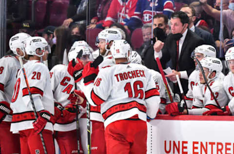 MONTREAL, QC – OCTOBER 21: Head coach of the Carolina Hurricanes Rod Brind’Amour gathers his players around the bench during the third period against the Montreal Canadiens at Centre Bell on October 21, 2021, in Montreal, Canada. The Carolina Hurricanes defeated the Montreal Canadiens 4-1. (Photo by Minas Panagiotakis/Getty Images)