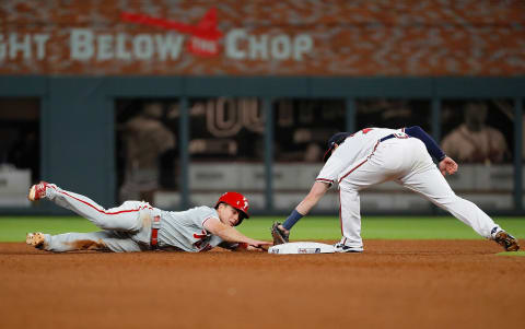 Kingery hangs on by his fingertips after going in hot for a two bagger. Photo by Kevin C. Cox/Getty Images.