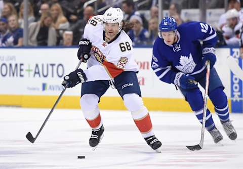 Mar 28, 2017; Toronto, Ontario, CAN; Florida Panthers forward Jaromir Jagr (68) skates with the puck past Toronto Maple Leafs forward Connor Brown during the first period at Air Canada Centre. Mandatory Credit: Dan Hamilton-USA TODAY Sports