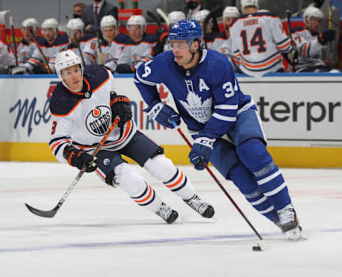 TORONTO,ON – JANUARY 20: Kyle Turris #8 of the Edmonton Oilers skates to check Auston Matthews #34 of the Toronto Maple Leafs . (Photo by Claus Andersen/Getty Images)