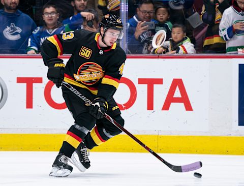 VANCOUVER, BC – NOVEMBER 16: Quinn Hughes #43 of the Vancouver Canucks skates with the puck during the pre-game warm up prior to NHL action against the Colorado Avalanche at Rogers Arena on November 16, 2019 in Vancouver, Canada. (Photo by Rich Lam/Getty Images)