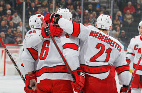 SAINT PAUL, MN – NOVEMBER 16: Joel Edmundson celebrates his goal with teammates Martin Necas #88 and Nino Niederreiter #21 of the Carolina Hurricanes during the game at the Xcel Energy Center on November 16, 2019 in Saint Paul, Minnesota. (Photo by Bruce Kluckhohn/NHLI via Getty Images)