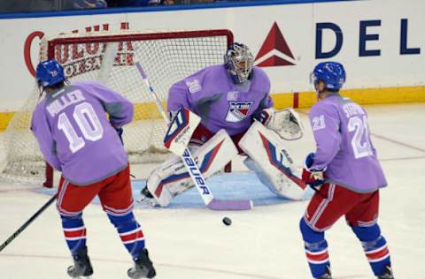 Henrik Lundqvist #30 and the New York Rangers wear special jerseys commemmorating Hockey Fights Cancer (Photo by Bruce Bennett/Getty Images)