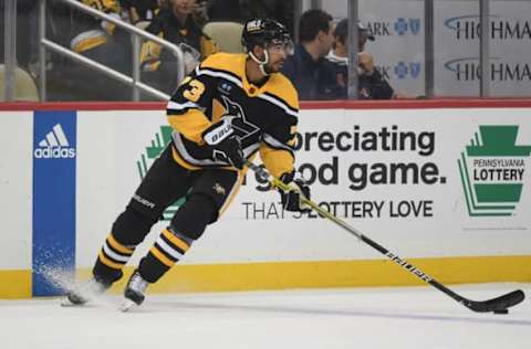 PITTSBURGH, PA – DECEMBER 20: Pierre-Olivier Joseph #73 of the Pittsburgh Penguins skates with the puck in the second period during the game against the New York Rangers at PPG PAINTS Arena on December 20, 2022, in Pittsburgh, Pennsylvania. (Photo by Justin Berl/Getty Images)