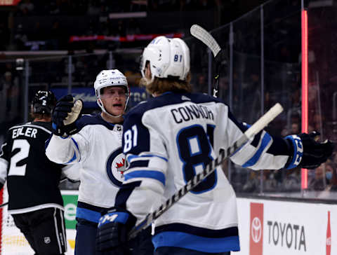 LOS ANGELES, CALIFORNIA – OCTOBER 28: Andrew Copp #9 of the Winnipeg Jets celebrates his goal on an assist by Kyle Connor #81, to tie the game 2-2 with the Los Angeles Kings during the third period in a 3-2 Jets win at Staples Center on October 28, 2021 in Los Angeles, California. (Photo by Harry How/Getty Images)