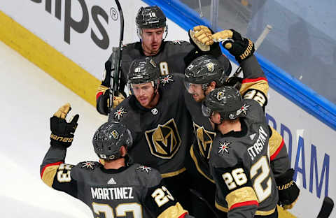 Shea Theodore #27 of the Vegas Golden Knights celebrates a goal with teammates during the second period against the Chicago Blackhawks in Game One of the Western Conference First Round.(Photo by Jeff Vinnick/Getty Images)