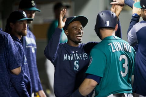 SEATTLE, WA – SEPTEMBER 28: Dee Gorrdon #9 of the Seattle Mariners celebrates with Mike Zunnino #3 after he scored on a single by Cameron Mayybin #10 in the eighth inning against the Texas Rangers at Safeco Field on September 28, 2018 in Seattle, Washington. (Photo by Lindsey Wasson/Getty Images)