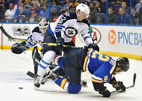 ST. LOUIS, MO. – APRIL 04: Winnipeg Jets defenseman Nelson Nogler (62) collides with St. Louis Blues leftwing Zach Sanford (82) while going after a loose puck during an NHL game between the Winnipeg Jets and the St. Louis Blues on April 04, 2017, at the Scottrade Center in St. Louis, MO. The Jets won, 5-2. (Photo by Keith Gillett/Icon Sportswire via Getty Images)