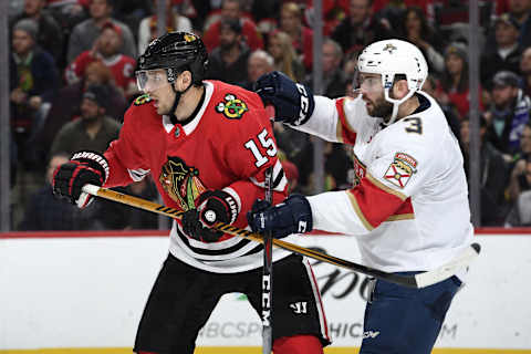 CHICAGO, IL – DECEMBER 12: Artem Anisimov #15 of the Chicago Blackhawks and Keith Yandle #3 of the Florida Panthers stand in position on the ice in the third period at the United Center on December 12, 2017 in Chicago, Illinois. The Chicago Blackhawks defeated the Florida Panthers 3-2. (Photo by Bill Smith/NHLI via Getty Images)