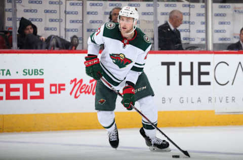 GLENDALE, ARIZONA – DECEMBER 19: Carson Soucy #21 of the Minnesota Wild skates with the puck against the Arizona Coyotes during the second period of the NHL game at Gila River Arena on December 19, 2019, in Glendale, Arizona. (Photo by Christian Petersen/Getty Images)