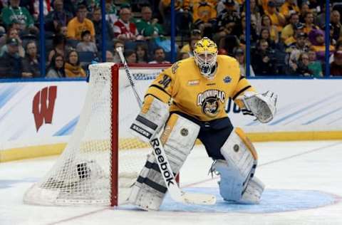 Apr 7, 2016; Tampa, FL, USA; Quinnipiac Bobcats goalie Michael Garteig (34) watches the action during the first period of the semifinals of the 2016 Frozen Four college ice hockey tournament against the Boston College Eagles at Amalie Arena. Mandatory Credit: Kim Klement-USA TODAY Sports