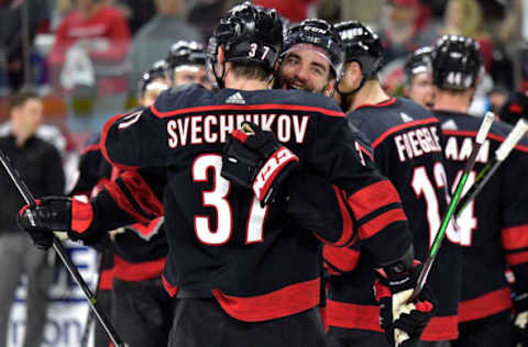 RALEIGH, NORTH CAROLINA – MAY 03: Jordan Martinook #48 and Andrei Svechnikov #37 of the Carolina Hurricanes celebrate after a win against the New York Islanders in Game Four of the Eastern Conference Second Round during the 2019 NHL Stanley Cup Playoffs at PNC Arena on May 03, 2019, in Raleigh, North Carolina. The Hurricanes won 5-2 and won the series, 4-0. (Photo by Grant Halverson/Getty Images)