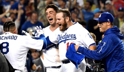 LOS ANGELES, CA- OCTOBER 27: Max Muncy, center, of the Los Angeles Dodgers reacts after hitting the game winning home run to defeat the Boston Red Sox in the 18th inning of during game three of the World Series at Dodger Stadium on Friday, October 27, 2018 in Los Angeles, California. (Photo by Keith Birmingham/Digital First Media/Pasadena Star-News via Getty Images)